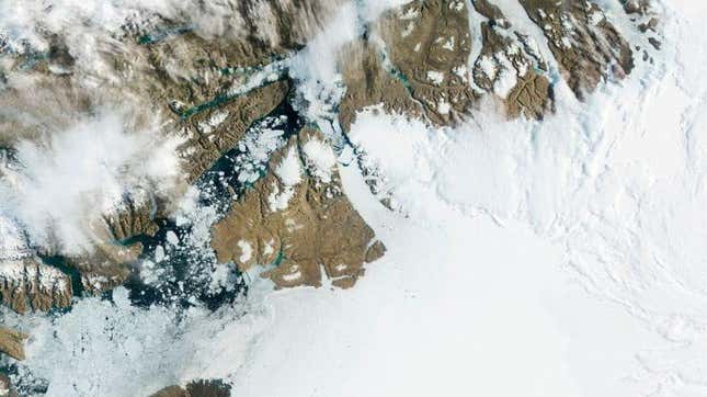 Petermann Glacier in northwest Greenland gradually moves toward the ocean, with large segments breaking off and drifting away as icebergs.