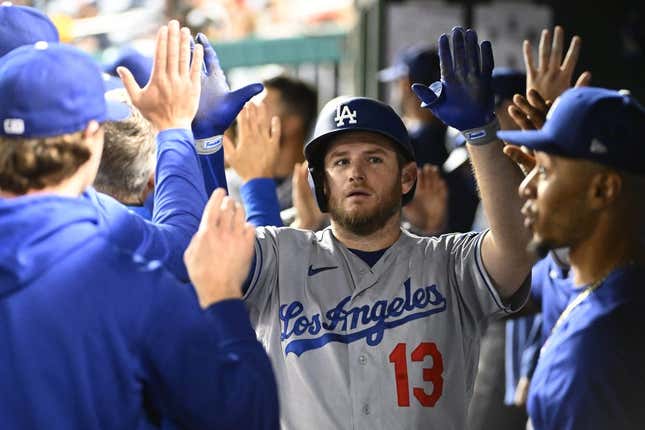 Sep 9, 2023; Washington, District of Columbia, USA; Los Angeles Dodgers third baseman Max Muncy (13) is congratulated by teammates after hitting a two run home run against the Washington Nationals during the eighth inning at Nationals Park.