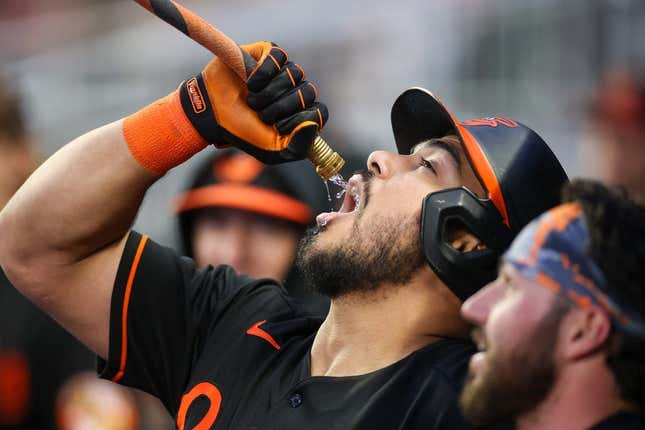 May 5, 2023; Atlanta, Georgia, USA; Baltimore Orioles right fielder Anthony Santander (25) drinks from the homer hose after a home run against the Atlanta Braves in the fourth inning at Truist Park.
