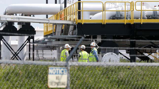 Workers at Enbridge Energy's terminal in Superior, Wisconsin, as seen in June 2018.