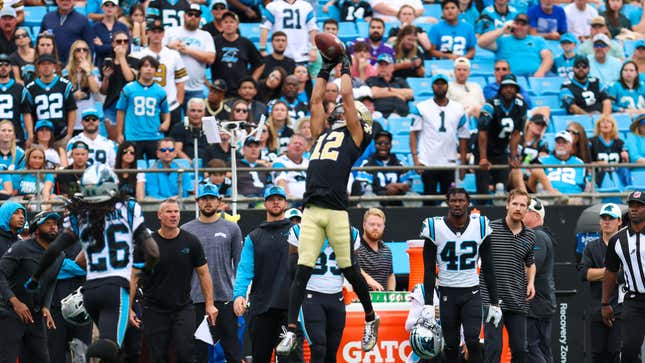 New Orleans Saints WR Chris Olave makes a leaping catch against the Carolina Panthers