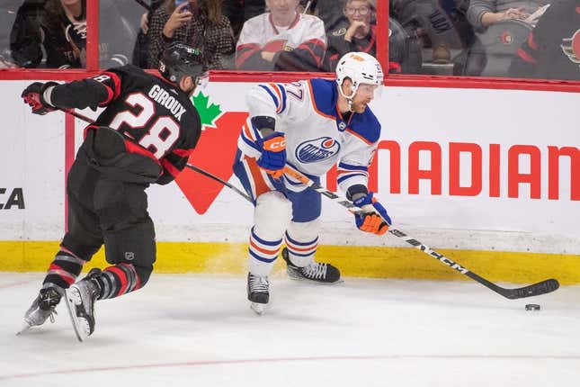 Feb 11, 2023; Ottawa, Ontario, CAN; Ottawa Senators right wing Claude Giroux (28) chases Edmonton Oilers defenseman Brett Kulak (27) who controls the puck in the third period at the Canadian Tire Centre.