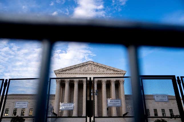 Temporary security fencing surrounds the U.S. Supreme Court in Washington, DC, on June 28, 2022. - The Supreme Court reinstated a Republican-drawn map of Louisiana Congressional districts this evening, keeping it in place for the 2022 election