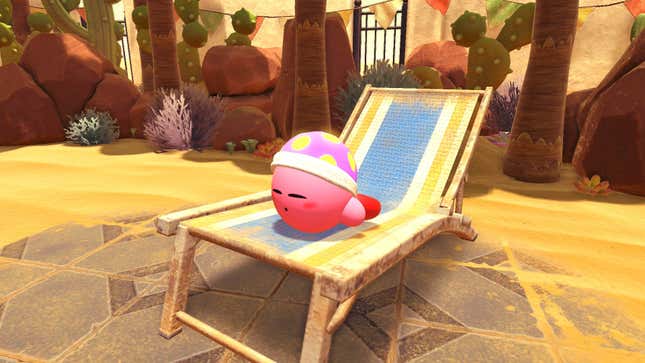 Kirby sleeping on a chaise lounge on a sandy beach.