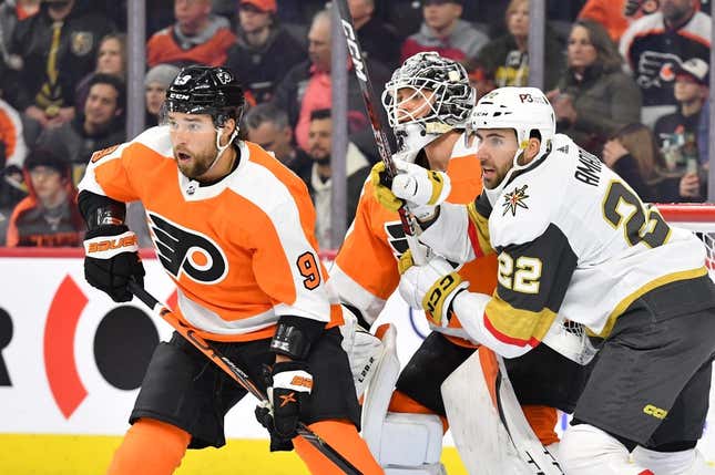 Mar 14, 2023; Philadelphia, Pennsylvania, USA; Vegas Golden Knights right wing Michael Amadio (22) and Philadelphia Flyers defenseman Ivan Provorov (9) battle for position in front of goaltender Felix Sandstrom (32) during the first period at Wells Fargo Center.