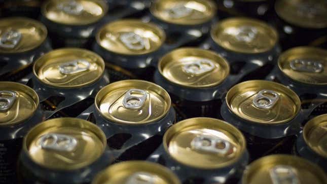 Cans of beer connected by plastic six-pack rings