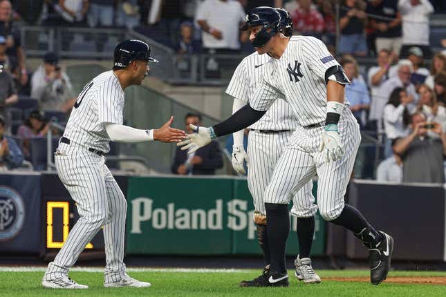 Aug 23, 2023; Bronx, New York, USA; New York Yankees right fielder Aaron Judge (99) celebrates his grand slam home run with center fielder Everson Pereira (80) during the second inning against the Washington Nationals at Yankee Stadium.
