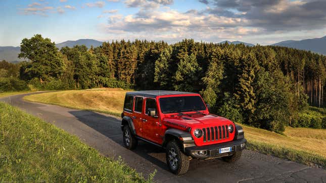 A photo of a red Jeep Wrangler. 
