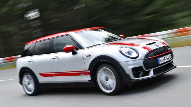 A photo of a silver and red Mini Clubman station wagon.
