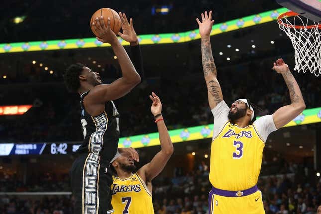 Feb 28, 2023; Memphis, Tennessee, USA; Memphis Grizzlies forward Jaren Jackson Jr. (13) shoots as Los Angeles Lakers forward Anthony Davis (3) defends during the first half at FedExForum.