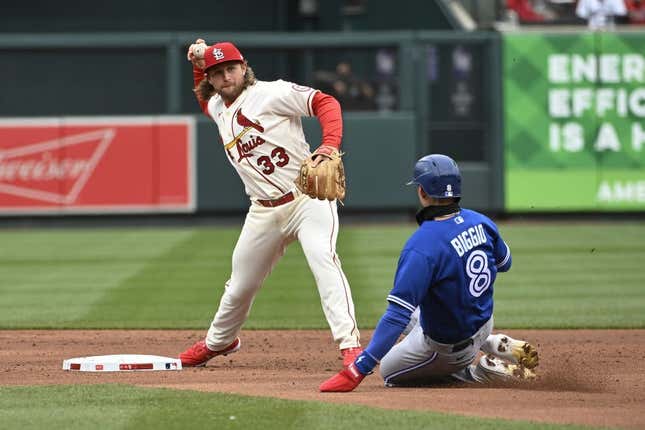 Apr 1, 2023; St. Louis, Missouri, USA; Toronto Blue Jays second baseman Cavan Biggio (8) is out at second as St. Louis Cardinals second baseman Brendan Donovan (33) turns a double play in the second inning at Busch Stadium.