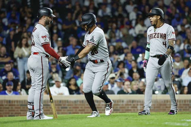 Sep 7, 2023; Chicago, Illinois, USA; Arizona Diamondbacks left fielder Tommy Pham (28) celebrates with first baseman Christian Walker (53) after hitting a two-run home run against the Chicago Cubs during the eight inning at Wrigley Field.