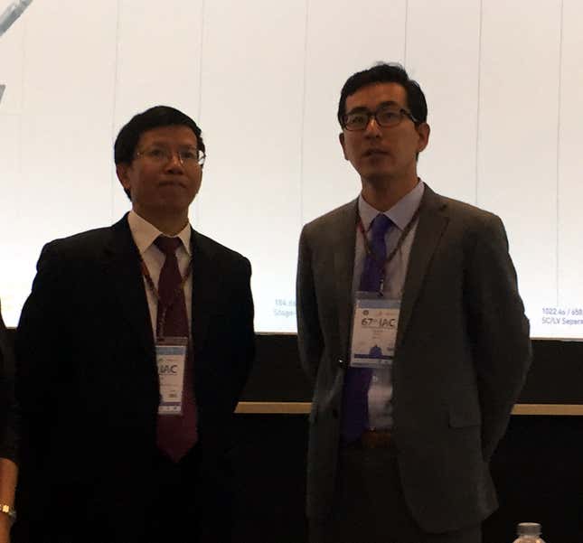 China Space Agency administrator Wu Yanhua and Landspace CEO Zhang Changwu confer at the International Astronautical Congress.