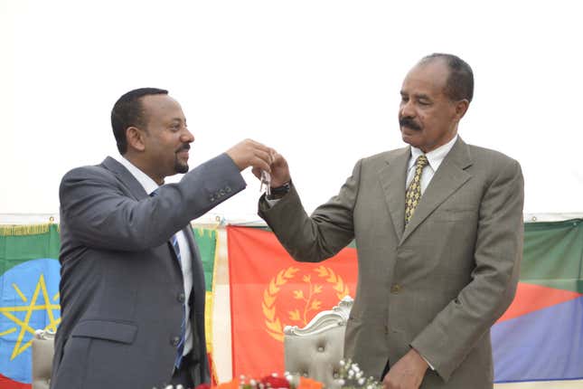 Ethiopia's Prime Minister Abiy Ahmed (L) and Eritrea's President Isaias Afwerki (R) attend the re-opening of the Eritrean embassy in the Ethiopian capital Addis Ababa, Ethiopia, in a brief ceremony 16 July 2018. The leaders declared their 'state of war' over one week ago and Isaias spent the weekend in Ethiopia. Eritrea reopened its embassy in Ethiopia 16 July in further evidence of a rapid thaw between two countries that a week ago ended two decades of military stalemate over a border war in which tens of thousands died.