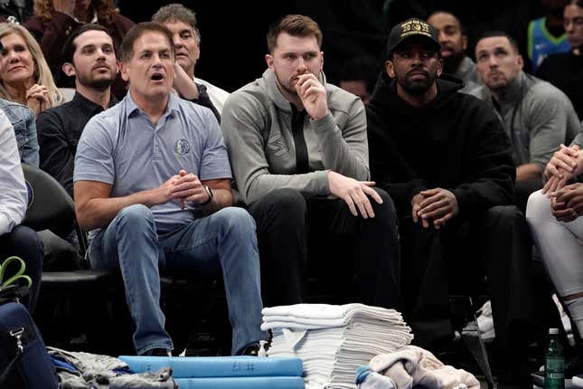 Mavericks owner Mark Cuban takes in a game with his top two players, Luka Doncic and Kyrie Irving, out of uniform.