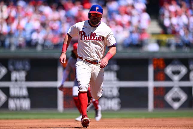 Apr 9, 2023; Philadelphia, Pennsylvania, USA; Philadelphia Phillies outfielder Kyle Schwarber (12) advances toward third to score against the Cincinnati Reds in the first inning at Citizens Bank Park.