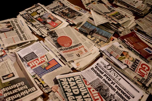 Newspapers on a table.