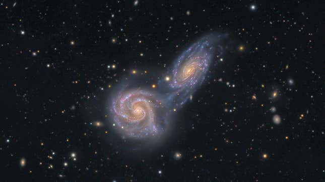 A pair of galaxies spinning towards one another.