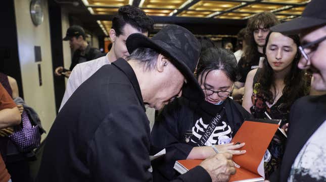 Amano signs autographs at the Japan Society screening of Angel's Egg.