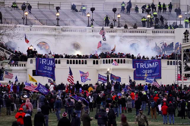 Violent protesters, loyal to President Donald Trump, storm the Capitol, Wednesday, Jan. 6, 2021, in Washington. The House committee investigating the Jan. 6 insurrection poked another hole in the pro-Trump conspiracy theory that federal agents orchestrated the attack, confirming on Tuesday, Jan. 11, 2022, that a man at the center of the claims said he’d never been an FBI informant.