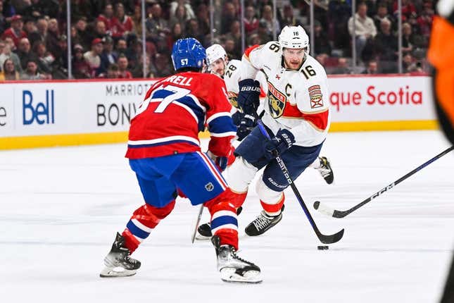 Mar 30, 2023; Montreal, Quebec, CAN; Florida Panthers center Aleksander Barkov (16) plays the puck against Montreal Canadiens center Sean Farrell (57) during the first period at Bell Centre.