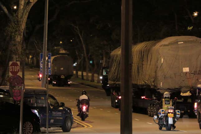 Shrouded train cars leave Singapore’s Bishan Depot on the morning of June 12.