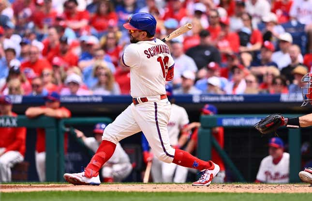 May 7, 2023; Philadelphia, Pennsylvania, USA; Philadelphia Phillies outfielder Kyle Schwarber (12) hits an RBI single against the Boston Red Sox in the fourth inning at Citizens Bank Park.