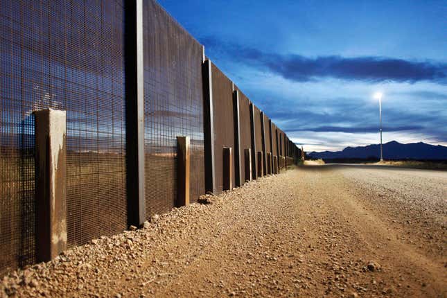 The Arizona-Mexico border fence near Naco, Arizona, March 29, 2013. Despite the additional fencing and agents, Property owner Bill Odle says their Border Patrol's presence on the line is only intermittent. Picture taken March 29, 2013. REUTERS/Samantha Sais (UNITED STATES - Tags: SOCIETY IMMIGRATION) - RTXYV2Q