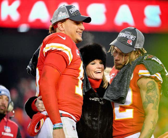 Jan 19, 2020; Kansas City, Missouri, USA; KKansas City Chiefs quarterback Patrick Mahomes (15) and strong safety Tyrann Mathieu (32) celebrate with Norma Hunt on stage after the AFC Championship Game against the Tennessee Titans at Arrowhead Stadium.