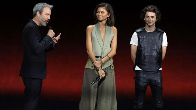 Dune: Part Two director Denis Villeneuve and stars Zendaya and Timothée Chalamet on stage at CinemaCon 2023.