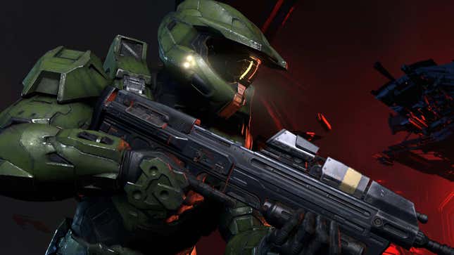 Master Chief holds an assault rifle in a Banished base in Halo Infinite.