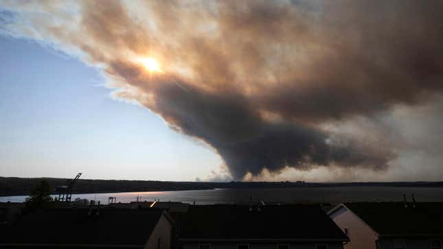 Thick plumes of heavy smoke fill the Halifax sky as an out-of-control fire in a suburban community quickly spread, engulfing multiple homes and forcing the evacuation of local residents, in Halifax, Nova Scotia, on Sunday May 28, 2023.