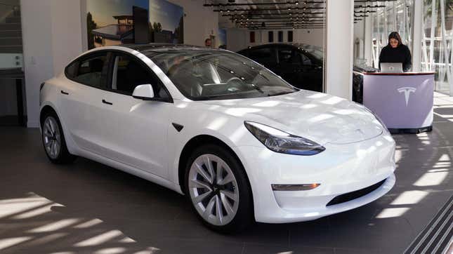 A photo of a Tesla Model 3 in a showroom