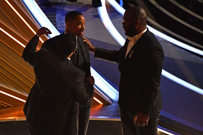 Denzel Washington (L), Will Smith (C) and Tyler Perry chat during the 94th Oscars at the Dolby Theatre in Hollywood, California on March 27, 2022.