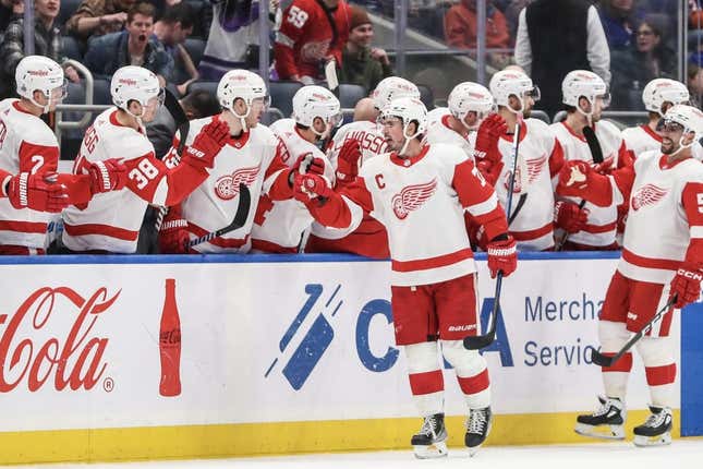 Mar 4, 2023; Elmont, New York, USA;  Detroit Red Wings center Dylan Larkin (71) celebrates with his teammates after scoring in the second period against the New York Islanders at UBS Arena.