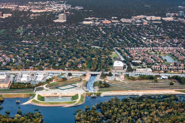 Barker Reservoir, looking from the reservoir toward the city. It shows how flooded it is, a month after the storm and how it’s outlet, the continuation of Buffalo Bayou flows right through very dense areas.