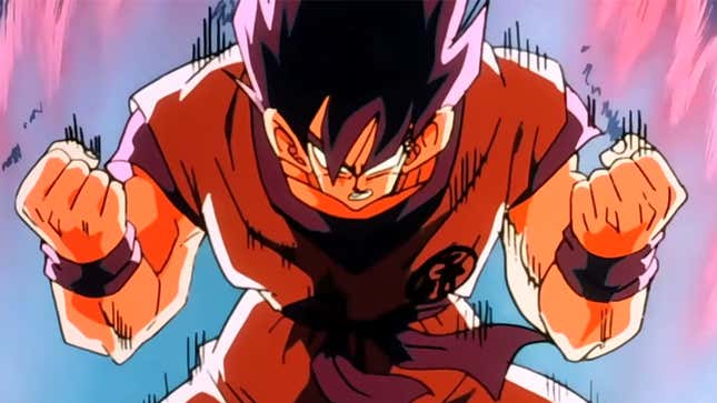 Goku clenches his fists in anger as he is surrounded by glowing energy.