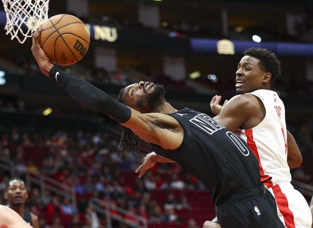 Mar 7, 2023; Houston, Texas, USA; Brooklyn Nets center Nerlens Noel (0) attempts to grab a rebound away from Houston Rockets forward Jae&#39;Sean Tate (8) during the first quarter at Toyota Center.