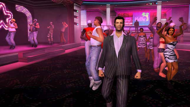 A guy wearing a pinstripe suit walking in a purple lit club in Grand Theft Auto Vice City