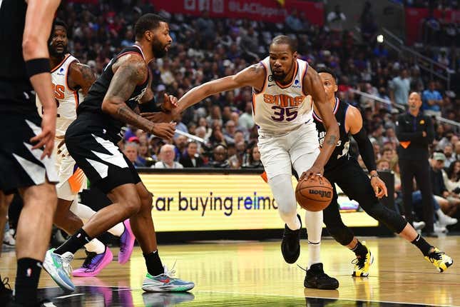 Apr 22, 2023; Los Angeles, California, USA; Phoenix Suns forward Kevin Durant (35) moves to the basket against Los Angeles Clippers forward Marcus Morris Sr. (8) during the first half in game four of the 2023 NBA playoffs at Crypto.com Arena.