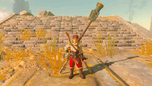 Link is seen with a cannon-fused staff on his back.