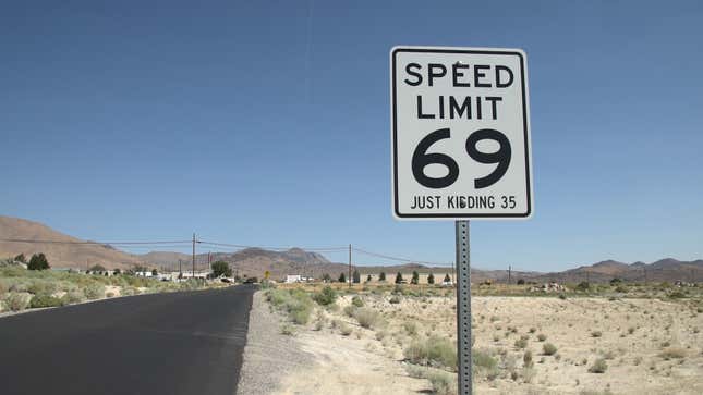 Fake speed limit sign outside Moonlite Bunny Ranch Brothel.
