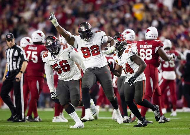 Dec 25, 2022; Glendale, Arizona, USA; Tampa Bay Buccaneers defensive end William Gholston (92) celebrates a fumble recovery against the Arizona Cardinals at State Farm Stadium.