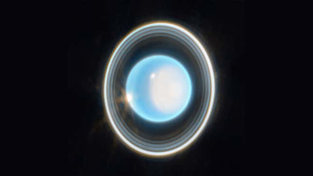 A blue Uranus appears with visible white rings. 