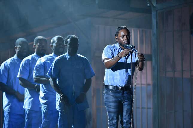 Rapper Kendrick Lamar (C) performs onstage during The 58th GRAMMY Awards at Staples Center on February 15, 2016 in Los Angeles, California.