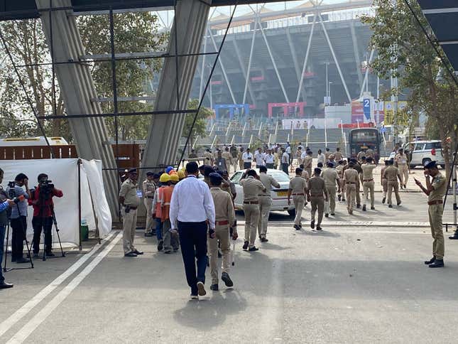 Police sanitising the cricket stadium a day before the Trump visit.
