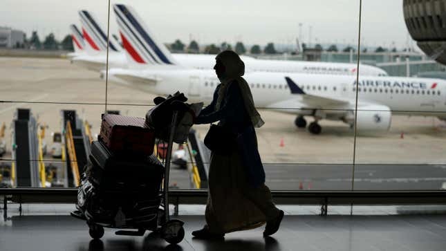 A traveler pulls her trolley Friday, Sept. 16, 2022 at Roissy Charles de Gaulle airport, north of Paris.