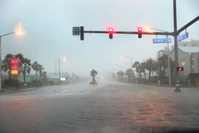 GULF SHORES, ALABAMA - SEPTEMBER 15: Water floods a road as the outer bands of Hurricane Sally come ashore on September 15, 2020, in Gulf Shores, Alabama.