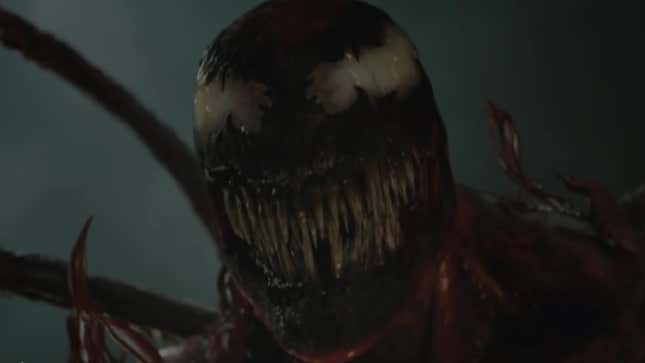 The oozing blood-red symbiote Carnage grins his overly fanged mouth.