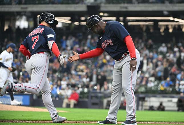 Apr 23, 2023; Milwaukee, Wisconsin, USA;Boston Red Sox left fielder Masataka Yoshida (7) celebrates with Boston Red Sox third base coach Carlos Febles (53) after hitting a home run against the Milwaukee Brewers in the eighth inning at American Family Field.